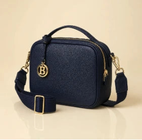 The Camera Crossbody in Navy with gold B charm