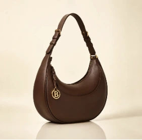 The Crescent Shoulder Bag in Chocolate with gold B charm