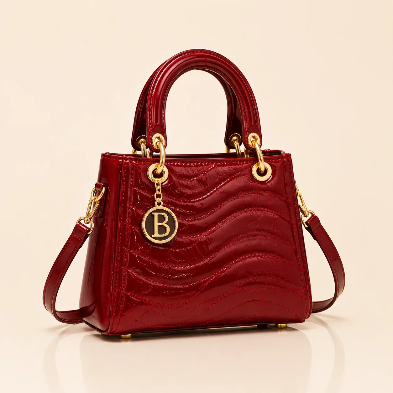 The Signature Bag in Burgundy with gold B charm