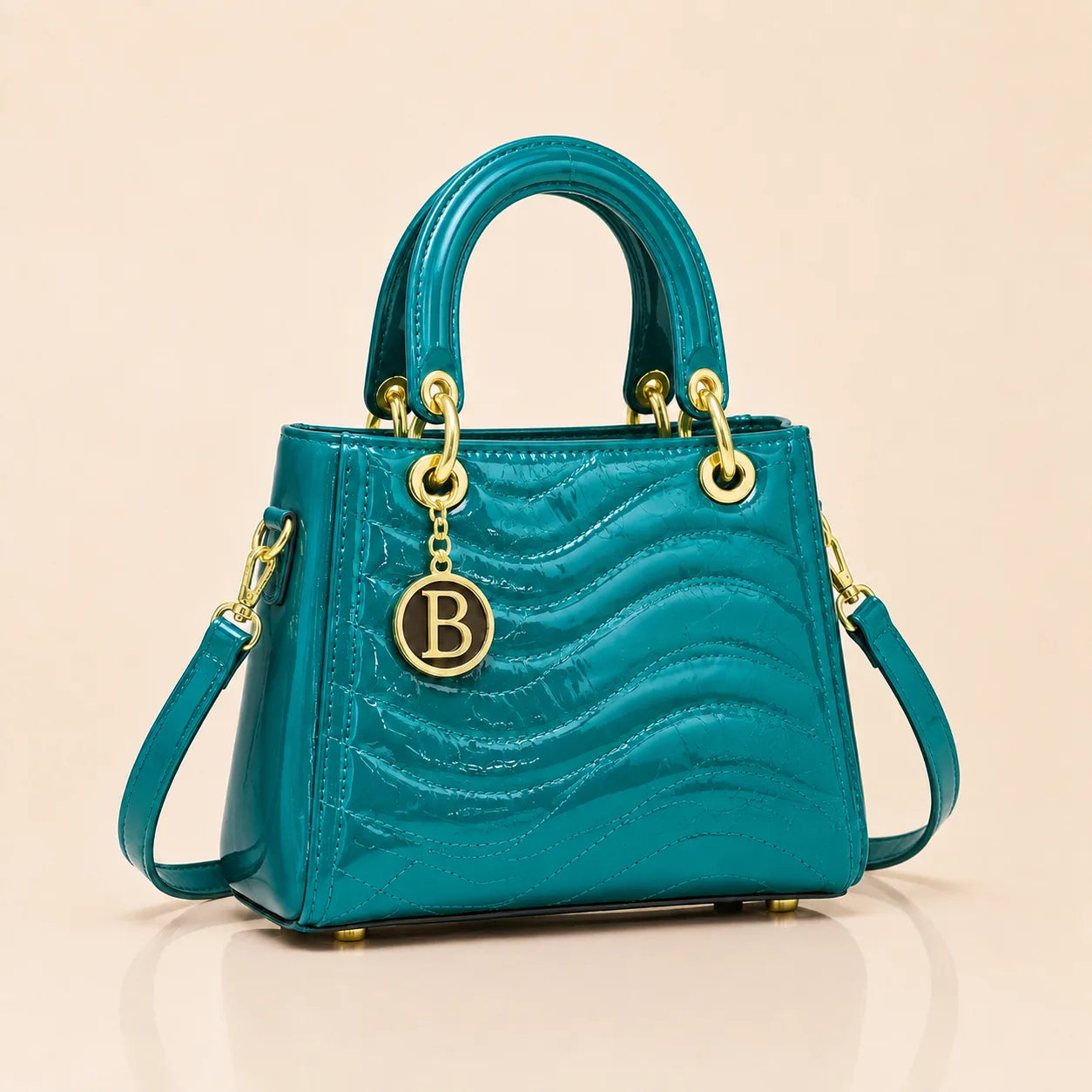 The Signature Bag in Turquoise with gold B charm